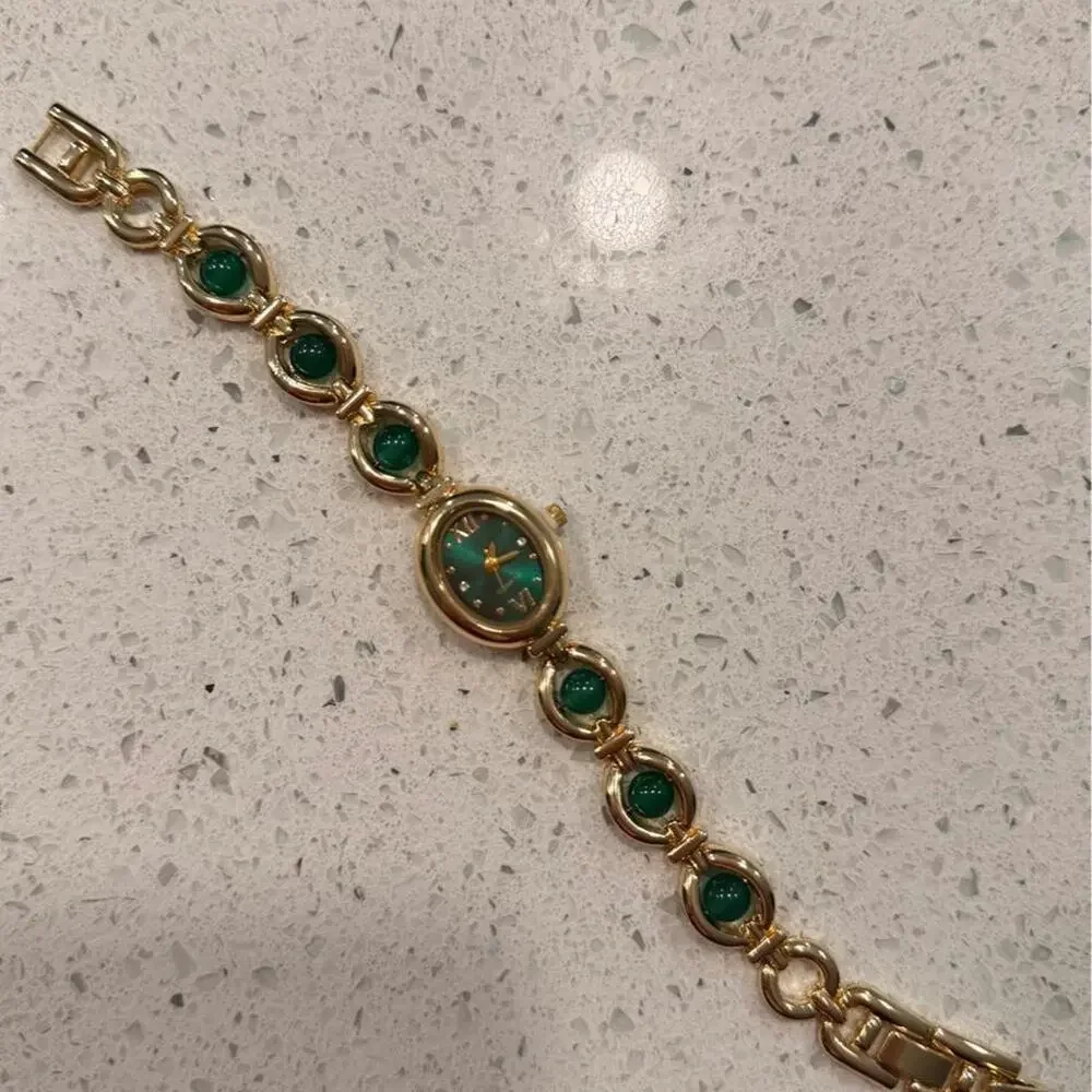 Gold and green vintage watch
